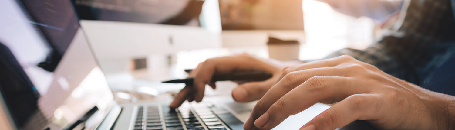 Header_hands on laptop keyboard